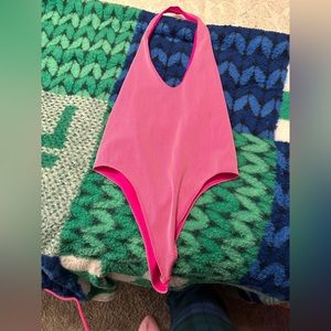 pink body suit